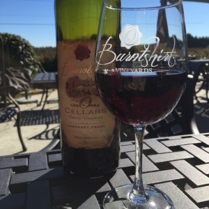 Sharing a bottle of Cabernet Franc on the terrace at Burntshirt Vineyards. 